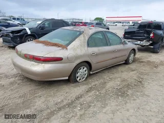 1999 Mercury Sable GS with VIN 1MEFM50U4XG601278, listed as a IAAI auction lot 41940748 with 1 mi miles. Bid and sale history available at carsss.com. Image 4.
