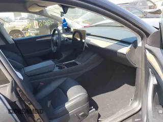 2024 Tesla Model Y Long Range with VIN 7SAYGDEE6RA225161, listed as a IAAI auction lot 42083140 with 28,289 mi miles and . Bid and sale history available at DreamBid. Image 5.
