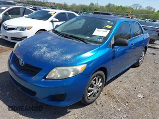 2009 Toyota Corolla with VIN 1NXBU40EX9Z065519, listed as a IAAI auction lot 42057981 with 201,480 mi miles. Bid and sale history available at carsss.com. Image 2.
