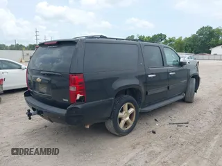2011 Chevrolet Suburban LT with VIN 1GNSCJE07BR128885, listed as a IAAI auction lot 42456748 with 201,789 mi miles and . Bid and sale history available at DreamBid. Image 4.