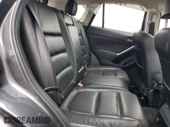 2016 Mazda CX-5 Grand Touring z VIN JM3KE4DY5G0741800, wystawiony jako Copart lot #58565455 z przebiegiem 33 675 mil mil oraz Szkoda całkowita • Salvage title. Historia ofert i sprzedaży dostępna na DreamBid. Obrazek 11.