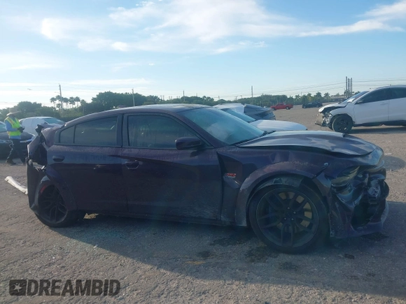 2021 Dodge Charger Scat Pack Widebody with VIN 2C3CDXGJXMH559036, listed as a IAAI auction lot 41895328 with 55,017 mi miles and . Bid and sale history available at DreamBid. Image 13.