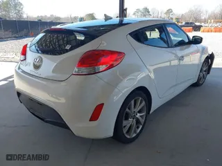 2016 Hyundai Veloster with VIN KMHTC6AD5GU268842, listed as a IAAI auction lot 41672376 with 156,703 mi miles. Bid and sale history available at carsss.com. Image 4.