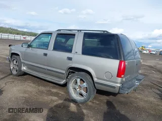 1999 GMC Yukon with VIN 1GKEK13R2XJ712390, listed as a IAAI auction lot 41793649 with 222,721 mi miles. Bid and sale history available at carsss.com. Image 3.