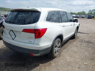 2017 Honda Pilot EX-L with VIN 5FNYF6H5XHB005000, listed as a IAAI auction lot 42039832 with 141,592 mi miles and . Bid and sale history available at DreamBid. Image 4.