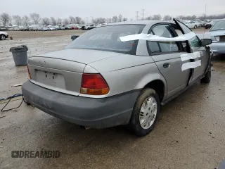 1998 Saturn SL z VIN 1G8ZG5288WZ306574, wystawiony jako Copart lot #86627384 z przebiegiem Nie podano mil oraz Nie do naprawy. Historia ofert i sprzedaży dostępna na DreamBid. Obrazek 3.