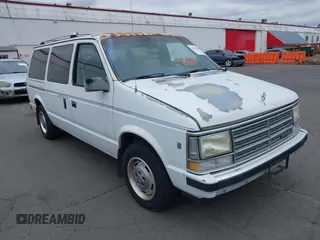 1989 Dodge Grand Caravan z VIN 1B4FK4438KX676509, wystawiony jako IAAI lot #42503682 z przebiegiem 158 471 mil mil oraz . Historia ofert i sprzedaży dostępna na DreamBid. Obrazek 1.