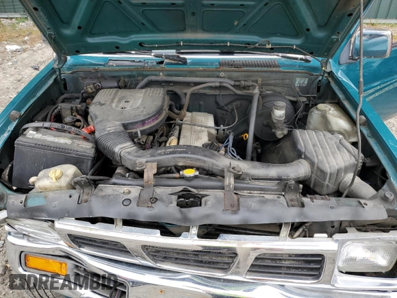 1997 Nissan Frontier XE with VIN 1N6SD16Y0VC329686, listed as a Copart auction lot 73103584 with 105,657 mi miles and Salvage title. Bid and sale history available at DreamBid. Image 11.