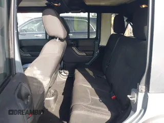 2014 Jeep Wrangler Unlimited Sport with VIN 1C4BJWDG9EL309763, listed as a IAAI auction lot 41378132 with 117,029 mi miles. Bid and sale history available at carsss.com. Image 19.