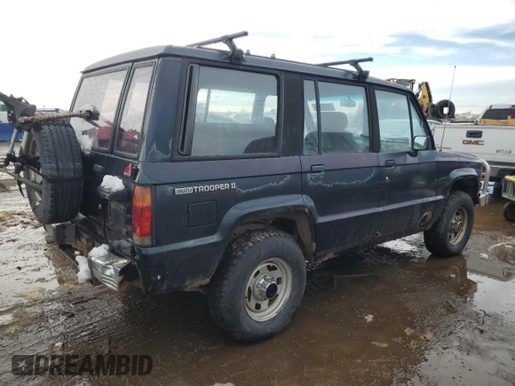 1991 Isuzu Trooper z VIN JACCH58E3M7900325, wystawiony jako Copart lot #79525294 z przebiegiem 146 593 mil mil oraz Czysty tytuł • Clean title. Historia ofert i sprzedaży dostępna na DreamBid. Obrazek 3.