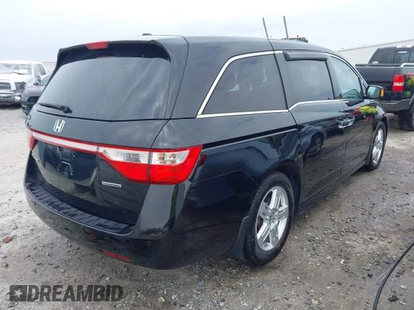 2012 Honda Odyssey Touring with VIN 5FNRL5H96CB058828, listed as a IAAI auction lot 41731389 with 152,295 mi miles and . Bid and sale history available at DreamBid. Image 4.