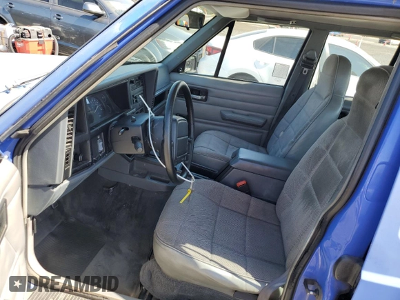 1996 Jeep Cherokee SE with VIN 1J4FT28S1TL108840, listed as a Copart auction lot 46951195 with 257,004 mi miles and Salvage Title. Bid and sale history available at carsss.com. Image 7.