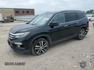 2016 Honda Pilot Touring with VIN 5FNYF6H94GB031500, listed as a Copart auction lot 59360375 with 132,507 mi miles and Salvage title. Bid and sale history available at DreamBid. Image 1.