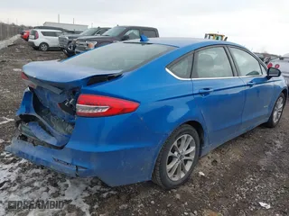 2019 Ford Fusion Hybrid SE with VIN 3FA6P0LUXKR131563, listed as a IAAI auction lot 41448736 with 165,440 mi miles. Bid and sale history available at carsss.com. Image 4.