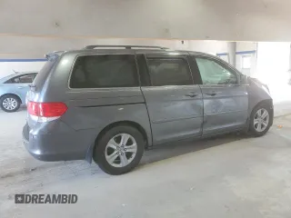2010 Honda Odyssey Touring with VIN 5FNRL3H91AB113770, listed as a Copart auction lot 61893115 with 155,776 mi miles and Salvage title. Bid and sale history available at DreamBid. Image 3.