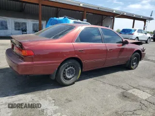 2000 Toyota Camry CE z VIN JT2BG22K4Y0449443, wystawiony jako Copart lot #58268475 z przebiegiem 292 853 mil mil oraz Szkoda całkowita • Salvage title. Historia ofert i sprzedaży dostępna na DreamBid. Obrazek 3.