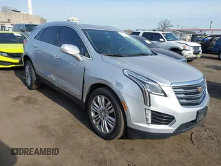 2019 Cadillac XT5 Premium Luxury AWD z VIN 1GYKNFRS2KZ227166, wystawiony jako IAAI lot #41786410 z przebiegiem 99 576 mil mil oraz . Historia ofert i sprzedaży dostępna na DreamBid. Obrazek 1.