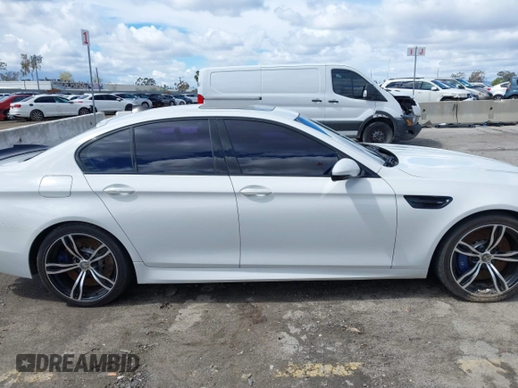 2013 BMW M5 with VIN WBSFV9C56DC772961, listed as a IAAI auction lot 41765457 with 104,568 mi miles. Bid and sale history available at carsss.com. Image 13.