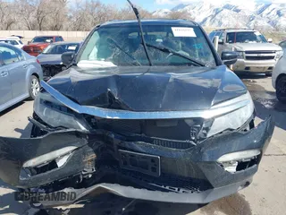 2016 Honda Pilot EX-L with VIN 5FNYF6H53GB048317, listed as a IAAI auction lot 41826297 with 127,672 mi miles. Bid and sale history available at carsss.com. Image 12.
