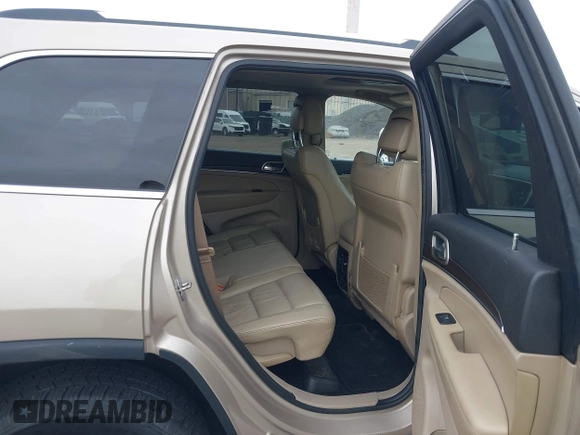 2014 Jeep Grand Cherokee Limited z VIN 1C4RJFBG8EC408754, wystawiony jako IAAI lot #42612211 z przebiegiem 149 017 mil mil oraz . Historia ofert i sprzedaży dostępna na DreamBid. Obrazek 8.