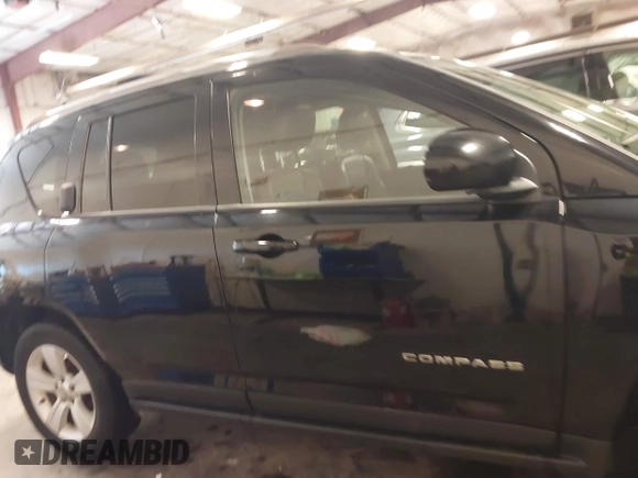 2015 Jeep Compass Latitude with VIN 1C4NJDEBXFD304409, listed as a IAAI auction lot 41629121 with 123,486 mi miles. Bid and sale history available at carsss.com. Image 14.