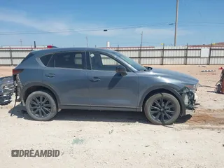 2023 Mazda CX-5 S Carbon Edition z VIN JM3KFBCM7P0164462, wystawiony jako IAAI lot #41919579 z przebiegiem 49 585 mil mil oraz . Historia ofert i sprzedaży dostępna na DreamBid. Obrazek 14.