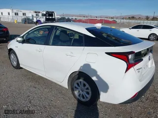 2021 Toyota Prius L Eco with VIN JTDKAMFU9M3150667, listed as a IAAI auction lot 41609328 with 59,177 mi miles. Bid and sale history available at carsss.com. Image 3.