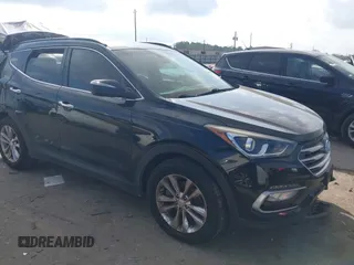 2018 Hyundai Santa Fe 2.0T z VIN 5XYZU4LA0JG561611, wystawiony jako IAAI lot #41533462 z przebiegiem 82 159 mil mil oraz . Historia ofert i sprzedaży dostępna na DreamBid. Obrazek 1.