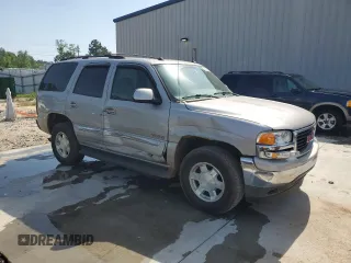 2005 GMC Yukon SLE z VIN 1GKEC13T75J179930, wystawiony jako Copart lot #57259205 z przebiegiem 310 454 mil mil oraz Szkody całkowita. Historia ofert i sprzedaży dostępna na DreamBid. Obrazek 4.