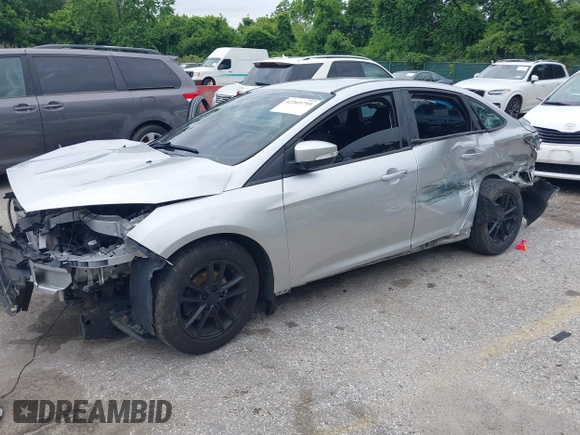 2016 Ford Focus SE z VIN 1FADP3F22GL373756, wystawiony jako IAAI lot #42369795 z przebiegiem 99 646 mil mil oraz . Historia ofert i sprzedaży dostępna na DreamBid. Obrazek 2.