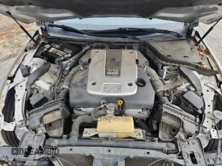 2014 Infiniti Q50 Premium with VIN JN1BV7AP4EM671611, listed as a Copart auction lot 63698505 with 134,904 mi miles and Salvage title. Bid and sale history available at DreamBid. Image 11.