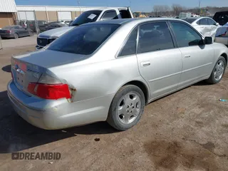 2003 Toyota Avalon XL z VIN 4T1BF28B43U323789, wystawiony jako IAAI lot #41416715 z przebiegiem 178 295 mil mil oraz . Historia ofert i sprzedaży dostępna na DreamBid. Obrazek 4.