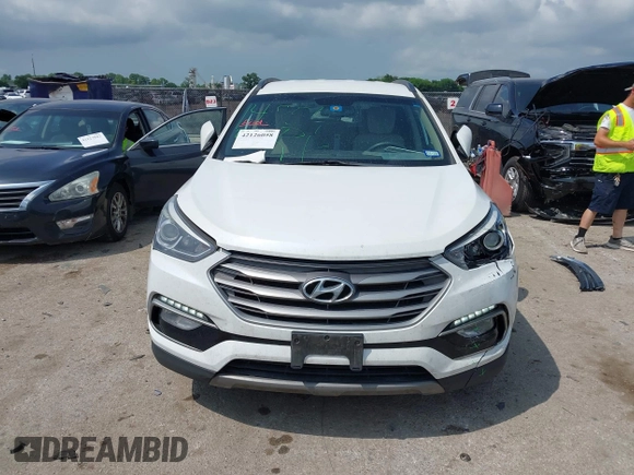 2018 Hyundai Santa Fe 2.4L z VIN 5NMZUDLB3JH055771, wystawiony jako IAAI lot #42126058 z przebiegiem 142 991 mil mil oraz . Historia ofert i sprzedaży dostępna na DreamBid. Obrazek 12.