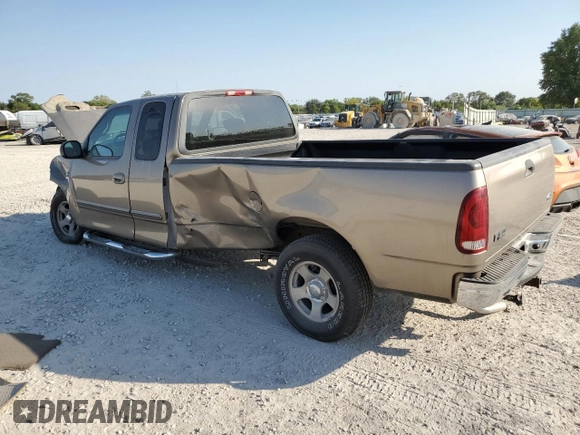 2002 Ford F-150 XL with VIN 1FTRX17L22NA48307, listed as a Copart auction lot 74238074 with 80,010 mi miles and Salvage title. Bid and sale history available at DreamBid. Image 2.