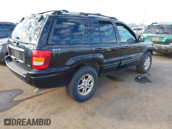 1999 Jeep Grand Cherokee Limited with VIN 1J4GW68NXXC637464, listed as a IAAI auction lot 41561690 with 235,728 mi miles. Bid and sale history available at carsss.com. Image 4.