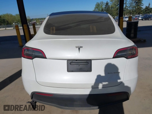 2024 Tesla Model Y Long Range with VIN 7SAYGAEEXRF988561, listed as a IAAI auction lot 42058248 with 7,845 mi miles. Bid and sale history available at carsss.com. Image 16.