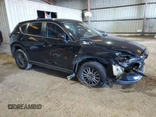 2017 Mazda CX-5 Sport with VIN JM3KFABL9H0210264, listed as a Copart auction lot 87918795 with 129,827 mi miles and Salvage Title. Bid and sale history available at carsss.com. Image 4.