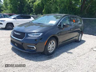 2023 Chrysler Pacifica Touring L with VIN 2C4RC1BG1PR606504, listed as a IAAI auction lot 42647652 with 41,598 mi miles and . Bid and sale history available at DreamBid. Image 2.