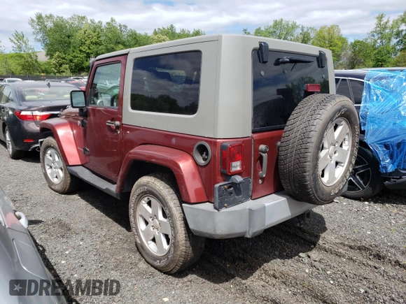 2008 Jeep Wrangler Sahara z VIN 1J4FA54198L505014, wystawiony jako Copart lot #55328045 z przebiegiem 128 049 mil mil oraz Szkoda całkowita • Salvage title. Historia ofert i sprzedaży dostępna na DreamBid. Obrazek 2.