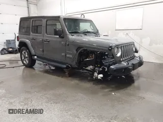 2019 Jeep Wrangler Unlimited Sahara with VIN 1C4HJXEG9KW656454, listed as a IAAI auction lot 41648236 with 75,403 mi miles and . Bid and sale history available at DreamBid. Image 1.