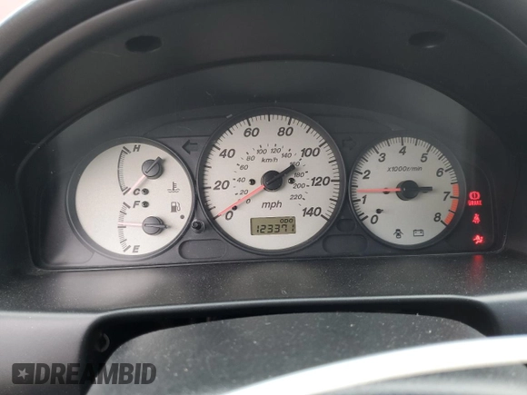 2002 Mazda Protege DX z VIN JM1BJ225320636991, wystawiony jako Copart lot #57915265 z przebiegiem 123 371 mil mil oraz Szkoda całkowita • Salvage title. Historia ofert i sprzedaży dostępna na DreamBid. Obrazek 9.