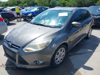 2012 Ford Focus SE with VIN 1FAHP3F28CL211898, listed as a IAAI auction lot 42466544 with 142,933 mi miles and . Bid and sale history available at DreamBid. Image 2.