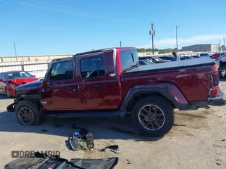 2021 Jeep Gladiator Overland z VIN 1C6HJTFGXML595781, wystawiony jako IAAI lot #41667696 z przebiegiem 31 438 mil mil oraz . Historia ofert i sprzedaży dostępna na DreamBid. Obrazek 14.