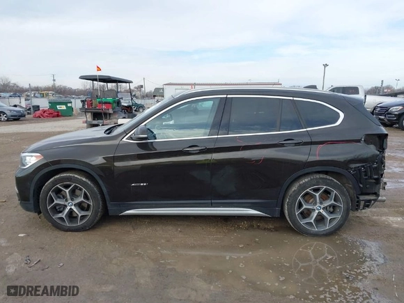 2017 BMW X1 xDrive28i with VIN WBXHT3C38H5F70947, listed as a IAAI auction lot 41652626 with 76,843 mi miles. Bid and sale history available at carsss.com. Image 15.