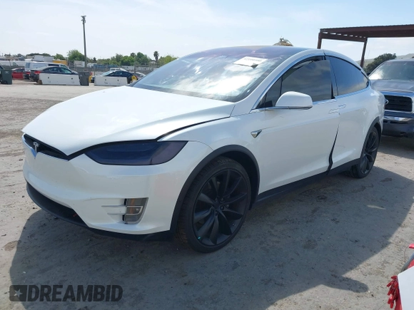 2021 Tesla Model X Long Range Plus with VIN 5YJXCBE23MF321243, listed as a IAAI auction lot 42100580 with 59,878 mi miles and . Bid and sale history available at carsss.com. Image 19.