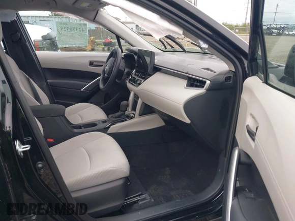 2023 Toyota Corolla Cross L with VIN 7MUAAABG3PV049367, listed as a IAAI auction lot 42370328 with 15,207 mi miles and . Bid and sale history available at DreamBid. Image 5.