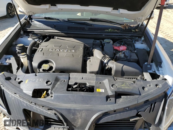2013 Lincoln MKS z VIN 1LNHL9DK0DG605400, wystawiony jako Copart lot #77071034 z przebiegiem 73 450 mil mil oraz Szkoda całkowita • Salvage title. Historia ofert i sprzedaży dostępna na DreamBid. Obrazek 12.