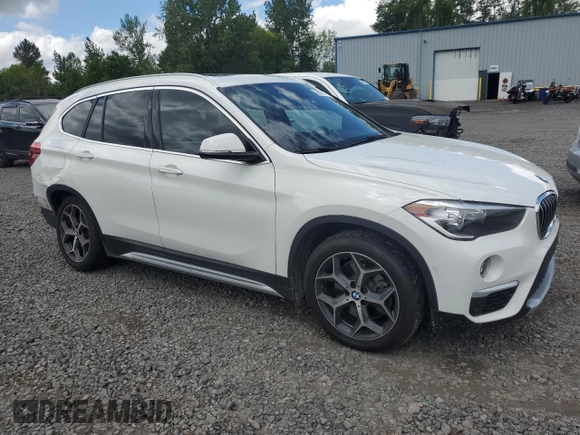 2018 BMW X1 xDrive28i with VIN WBXHT3C35J5L29298, listed as a Copart auction lot 59041435 with 27,612 mi miles and Salvage title. Bid and sale history available at DreamBid. Image 4.
