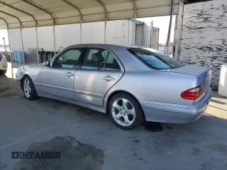 2002 Mercedes-Benz E-Class with VIN WDBJF65J12B488632, listed as a Copart auction lot 87060504 with 273,135 mi miles and Salvage Title. Bid and sale history available at carsss.com. Image 2.