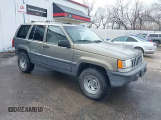 1995 Jeep Grand Cherokee Laredo with VIN 1J4FX58S2SC693240, listed as a IAAI auction lot 41796871 with 208,482 mi miles and . Bid and sale history available at DreamBid. Image 1.
